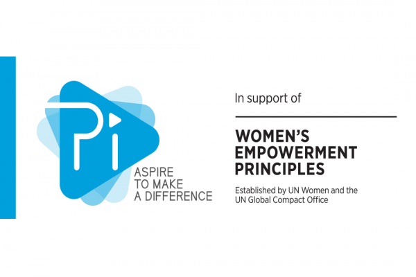 Whitney leaning against a railing on a downtown street